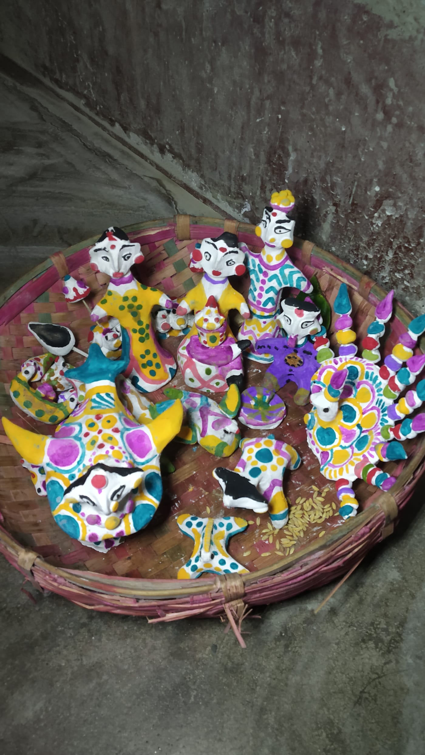 Moulding the clay birds — illustration in the Mithila style