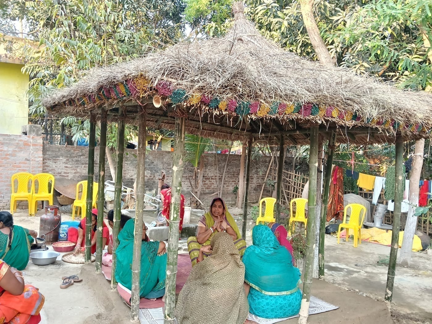 Raising the marwa canopy — illustration in the Mithila style